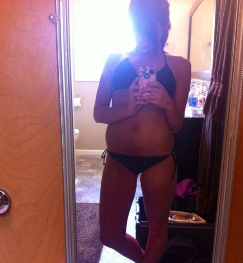 Anonymous in a bikini taking a selfie