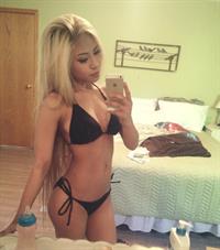 Anonymous in a bikini taking a selfie