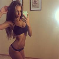 Galinka Mirgaeva in a bikini taking a selfie