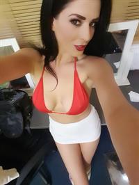 Ella Mai in a bikini taking a selfie