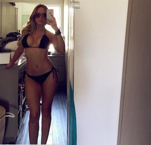 Katie May in a bikini taking a selfie