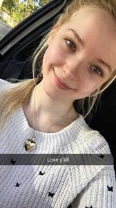 Dove Cameron taking a selfie