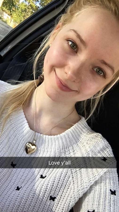 Dove Cameron taking a selfie