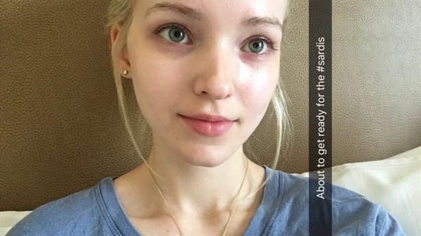 Dove Cameron taking a selfie