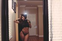 Tianna Gregory in a bikini taking a selfie