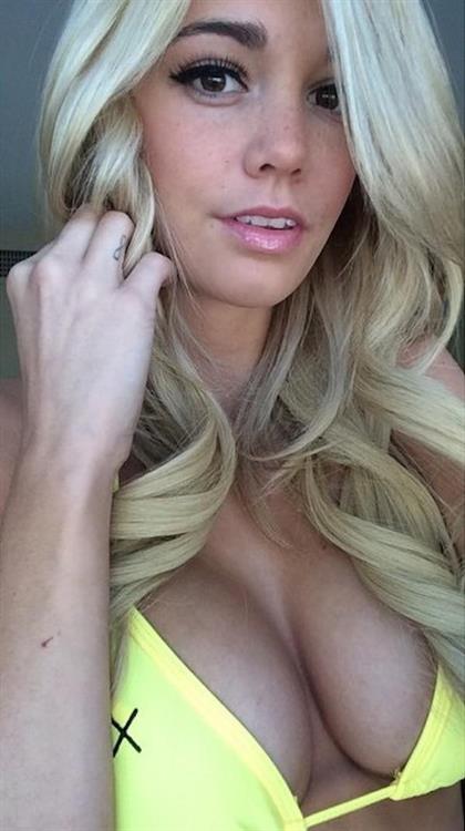Caitlin Arnett in a bikini taking a selfie