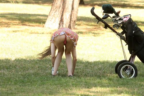 Alicia Arden golfing in a tiny skirt.  Upskirt pink panties.