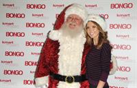Audrina Patridge poses with Santa Claus