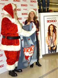 Audrina Patridge poses with Santa Claus