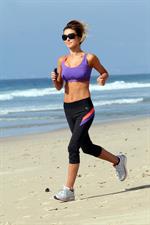 Audrina Patridge running on the beach in the South Bay