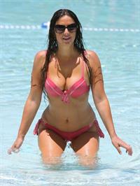 Claudia Romani takes a dip in a pool