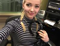 Dove Cameron taking a selfie