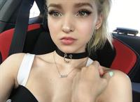 Dove Cameron taking a selfie
