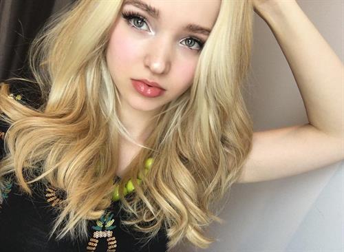 Dove Cameron taking a selfie