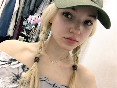Dove Cameron taking a selfie