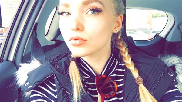 Dove Cameron taking a selfie