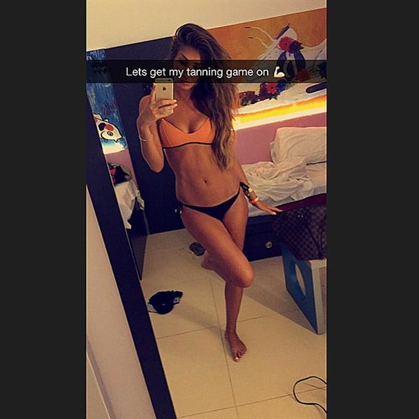 Megan McKenna in a bikini taking a selfie