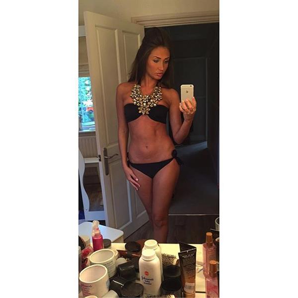 Megan McKenna in a bikini taking a selfie