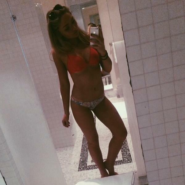 Natalie Alyn Lind in a bikini taking a selfie