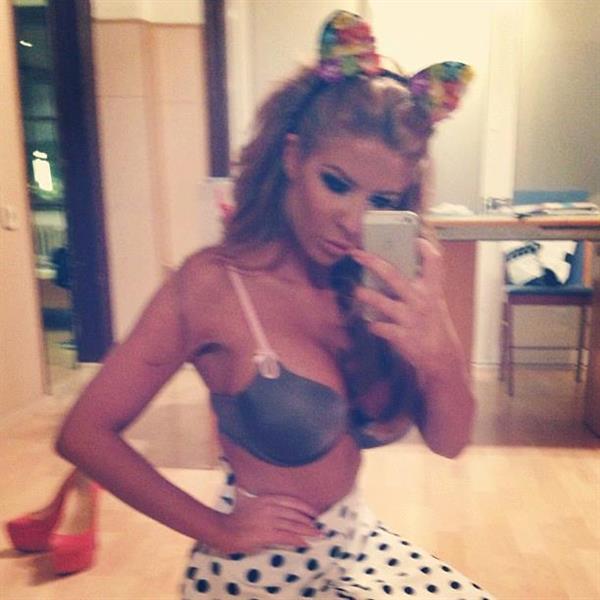 Andrea Ando in lingerie taking a selfie