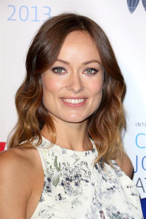 Olivia Wilde debuts her small baby bump while attending the 2013 International Women’s Media Foundation’s Courage in Journalism Awards at the Beverly Hills Hotel on Tuesday (October 29, 2013) in Beverly Hills, Calif.