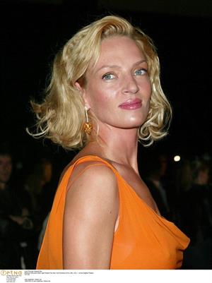 Uma Thurman in an orange dress
