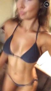 Amanda Cerny in a bikini taking a selfie