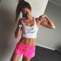 Kayla Itsines taking a selfie