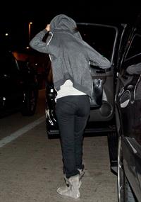 Selena Gomez departing out of LA, hiding her face