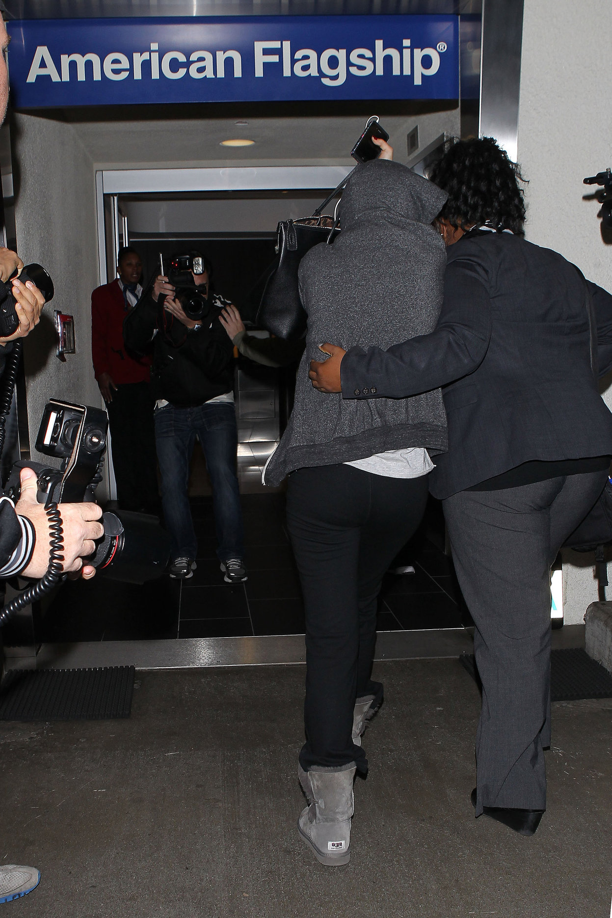 Selena Gomez departing out of LA, hiding her face