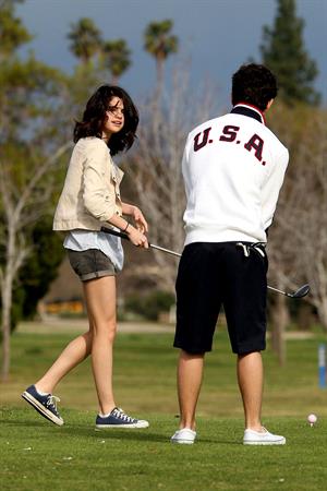 Selena Gomez golfing on February 2, 2010
