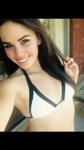 Alexis Young in a bikini taking a selfie