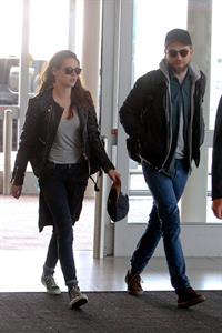 Kristen Stewart - Arrives at John F. Kennedy International Airport in New York City (8/5/2013) 