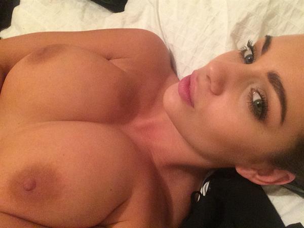 Holly Peers taking a selfie and - breasts