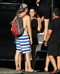 Katy Perry talks with a group of her friends after spending the afternoon at Raging Waters in San Dimas, California on August 12, 2012