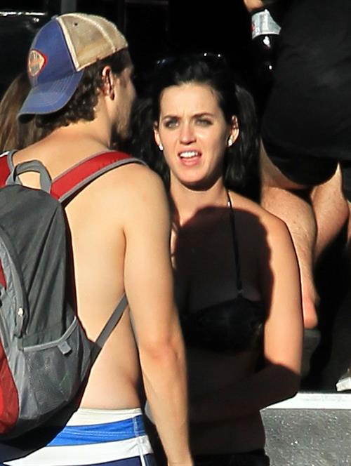 Katy Perry talks with a group of her friends after spending the afternoon at Raging Waters in San Dimas, California on August 12, 2012