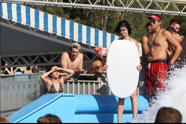 Katy Perry talks with a group of her friends after spending the afternoon at Raging Waters in San Dimas, California on August 12, 2012