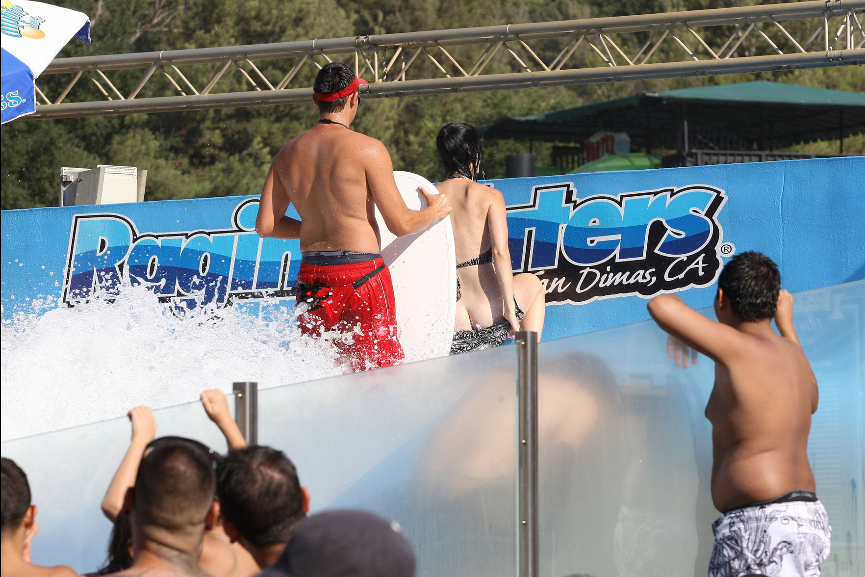 Katy Perry talks with a group of her friends after spending the afternoon at Raging Waters in San Dimas, California on August 12, 2012