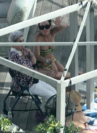 Katy Perry - In a bikini at a hotel pool in Miami July 27, 2012