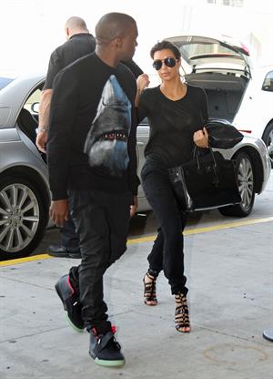 Kim Kardashian and Kanye West JFK airport in New York - 09 August 2012 