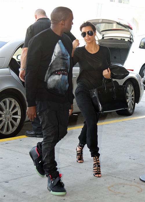 Kim Kardashian and Kanye West JFK airport in New York - 09 August 2012 