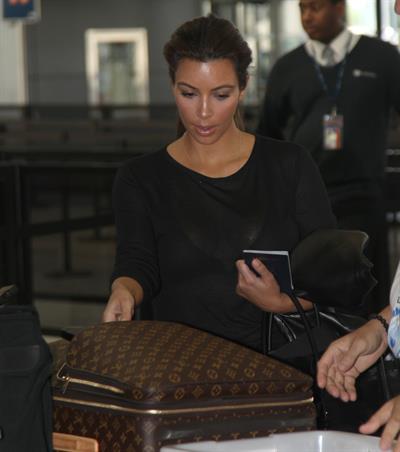 Kim Kardashian and Kanye West JFK airport in New York - 09 August 2012 