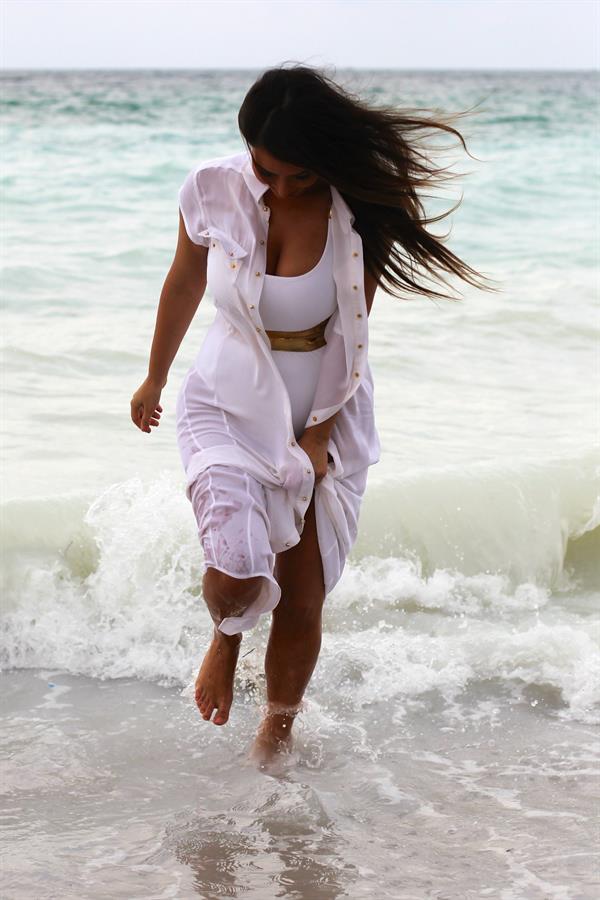 Kim Kardashian in a swimsuit at Miami beach 9/24/12