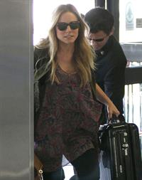 Kristen Bell - Departing on a flight at LAX - August 21, 2012