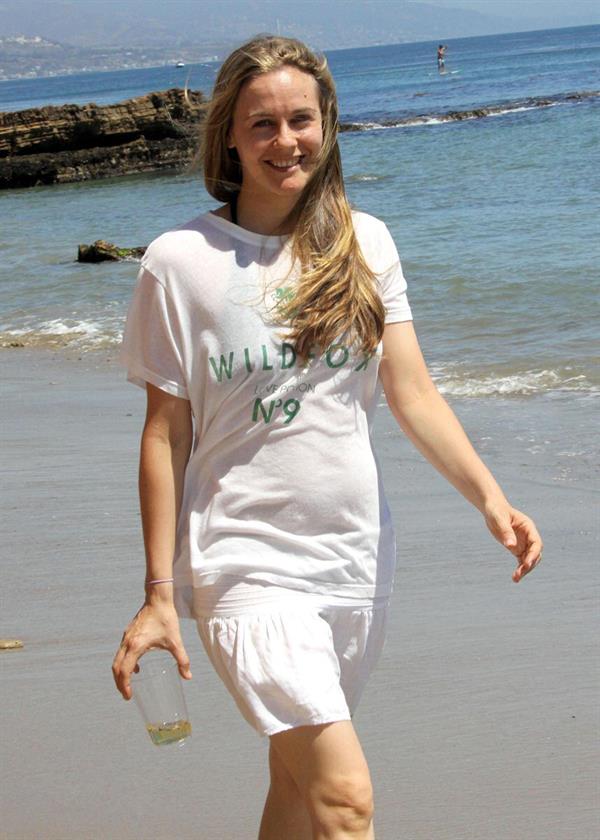 Alicia Silverstone walking on the beach in Malibu 
