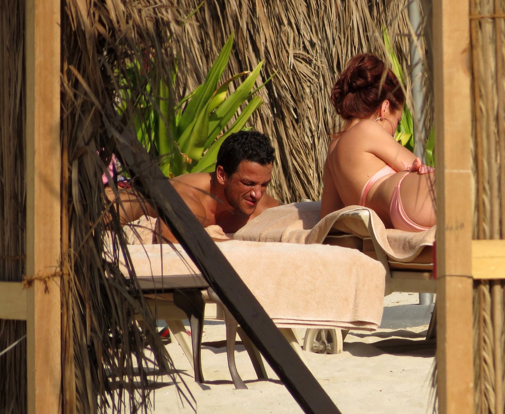 Amy Childs sunbathing with Peter Andre in Dubai on January 3, 2012