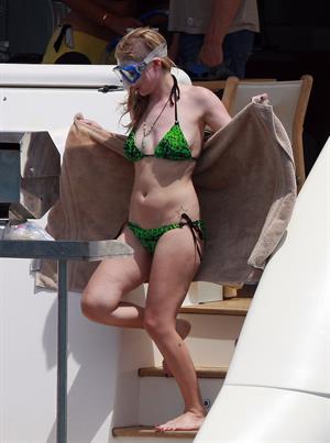 Avril Lavigne in a green bikini in Cabo, Mexico on July 27, 2012