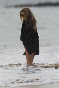 Carmen Electra – beach shoot candids in Hawaii 10/3/13  