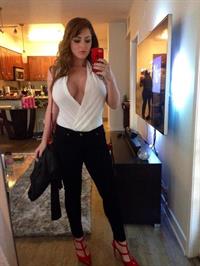 Sophie Dee taking a selfie