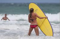 Daniela Hantuchova bikini beach surfing candids in Brisbane, Australia, December 26, 2012 